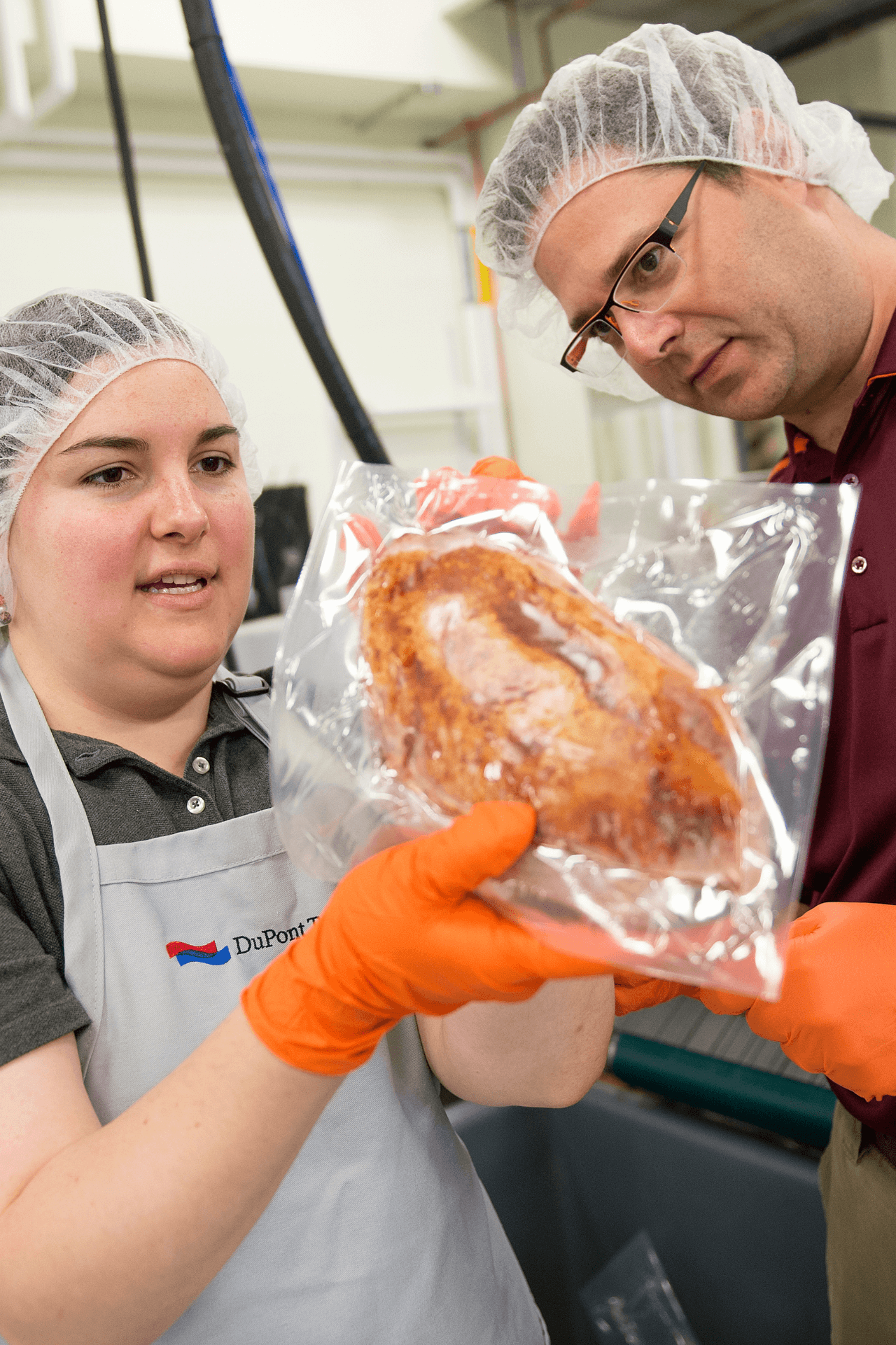 Two people examine food