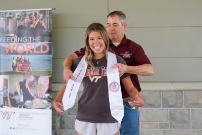 A student being awarded Outstanding Senior