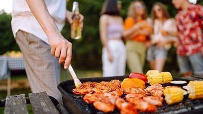 Food on a grill and beer