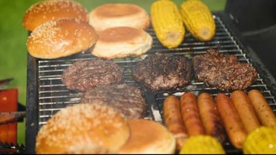 Burgers and hotdogs on a grill