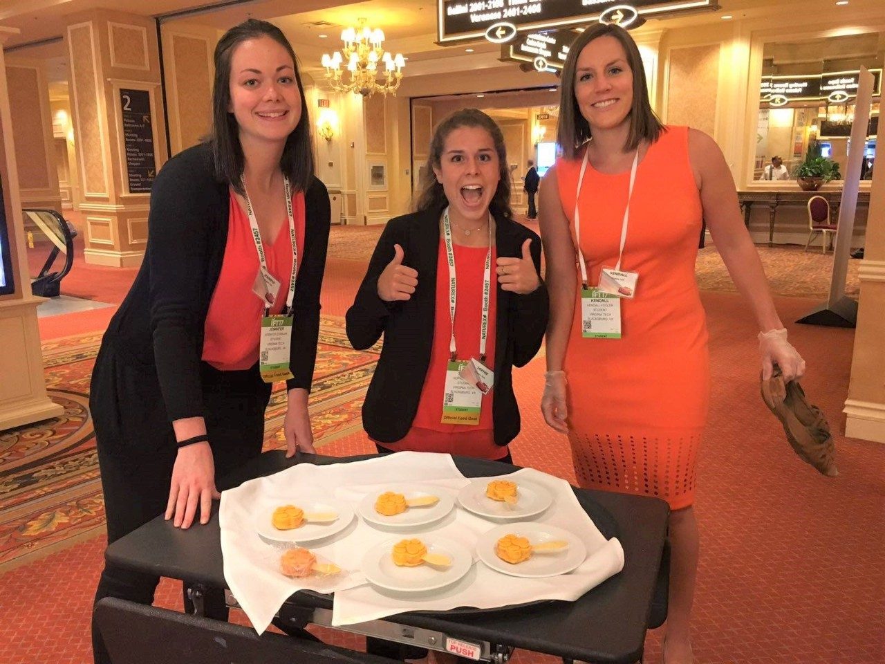Students pose with their creation at a food development competition.