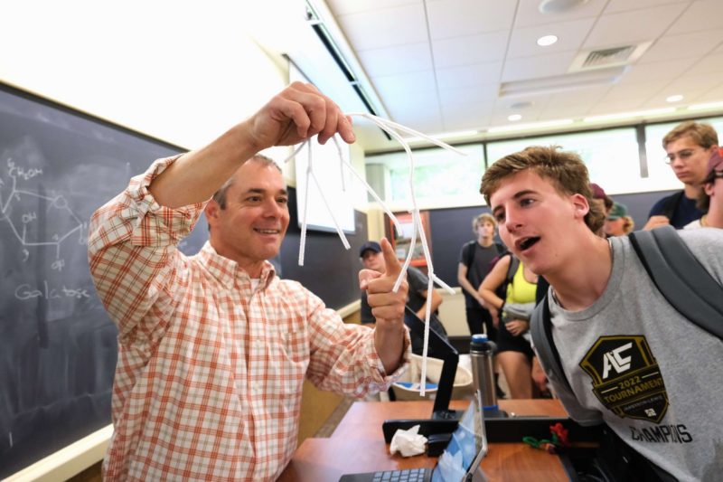 A professor does a demonstration in class.