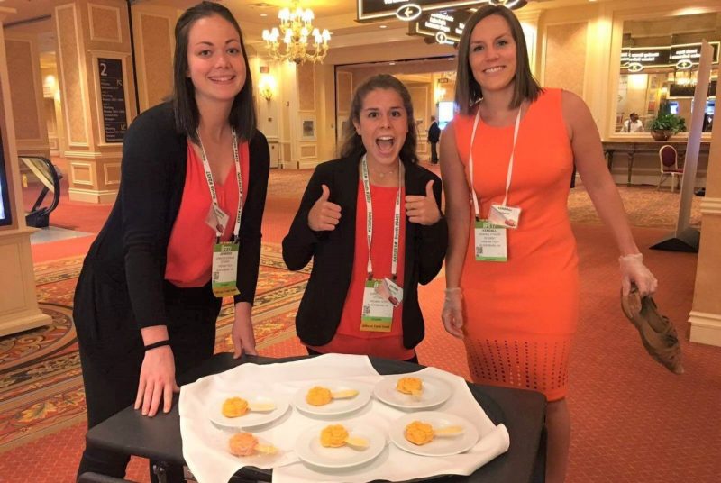 Students pose for a photo with their products for a competition.