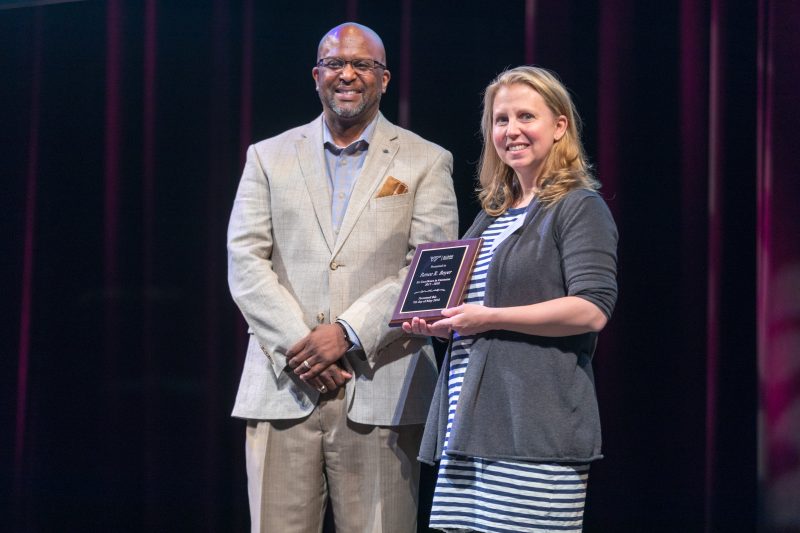 Renee Boyer receives the Alumni Award for Excellence in Extension from Senior Associate Vice President for Alumni Relations Matthew Winston