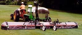 Figure 1. Photo shows pesticide application equipment with attached spray boom skirt directing virtually all of the spray to the turfgrass being treated.